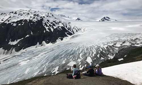 Guests relaxing at Exit Glacier and looking out to Harding Icefield